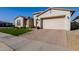 Attractive home with a paved driveway and well-kept lawn at 4834 S Meteor --, Mesa, AZ 85212