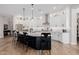 Modern kitchen featuring white cabinets, a dark island, and stainless steel appliances at 4834 S Meteor --, Mesa, AZ 85212