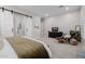 Main bedroom featuring neutral paint, television, and an ensuite bathroom at 4834 S Meteor --, Mesa, AZ 85212