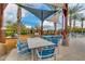 Relaxing outdoor dining area with shade canopies, grill, and comfortable seating at 4834 S Meteor --, Mesa, AZ 85212