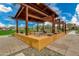 Charming outdoor gathering spot with metal seating under a modern pergola at 4834 S Meteor --, Mesa, AZ 85212