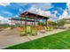 Inviting outdoor lounge with green Adirondack chairs under a pergola, perfect for relaxation at 4834 S Meteor --, Mesa, AZ 85212