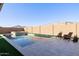 Inviting pool and spa area with decorative water feature and lounge chairs offer a serene outdoor retreat at 4834 S Meteor --, Mesa, AZ 85212