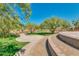 Beautiful park with walking paths, mature trees, and open green spaces at 4834 S Meteor --, Mesa, AZ 85212