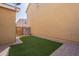 Cozy backyard with artificial turf and paver patio, offering a low-maintenance outdoor space at 504 N Ranger Trl, Gilbert, AZ 85234