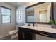 Bright bathroom with single sink vanity and tile flooring at 504 N Ranger Trl, Gilbert, AZ 85234