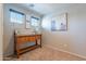 Bedroom with light brown carpet, natural light, and console table at 504 N Ranger Trl, Gilbert, AZ 85234