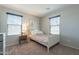 Cozy bedroom featuring a bed with pink bedding and artwork, plus natural light at 504 N Ranger Trl, Gilbert, AZ 85234