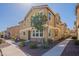 Corner lot home with a blend of stucco and stone accents, surrounded by a neatly landscaped yard and a clear blue sky at 504 N Ranger Trl, Gilbert, AZ 85234