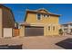 Attached garage with a brick driveway, providing convenient parking and enhancing the home's curb appeal at 504 N Ranger Trl, Gilbert, AZ 85234