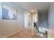 Upstairs hallway with neutral walls, carpet, and natural light at 504 N Ranger Trl, Gilbert, AZ 85234