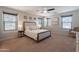 Spacious main bedroom with natural light, ceiling fan, and neutral color scheme at 504 N Ranger Trl, Gilbert, AZ 85234