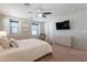 Well-lit main bedroom features light color palettes, ceiling fan, and ample natural light at 504 N Ranger Trl, Gilbert, AZ 85234