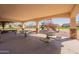 Relax in the covered picnic area with tables overlooking the community playground at 504 N Ranger Trl, Gilbert, AZ 85234