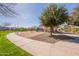 Community playground features slides, swings, and covered picnic area with lush landscaping and walking paths at 504 N Ranger Trl, Gilbert, AZ 85234