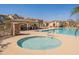 Community pool area includes a spa and seating areas, perfect for leisure and socializing at 504 N Ranger Trl, Gilbert, AZ 85234