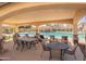 The community pool area provides a shady pavilion with table seating near the swimming pool at 504 N Ranger Trl, Gilbert, AZ 85234