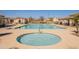 Resort-style pool area features a spa and lounge chairs, perfect for relaxation and recreation at 504 N Ranger Trl, Gilbert, AZ 85234