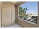 Balcony with view of parking and lush trees at 5302 E Van Buren St # 2060, Phoenix, AZ 85008