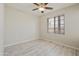 Bedroom featuring wood-look floors, a window, and neutral walls for a calm, inviting space at 5302 E Van Buren St # 2060, Phoenix, AZ 85008