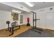 Bright home gym featuring weightlifting equipment and a punching bag for a complete fitness experience at 5302 E Van Buren St # 2060, Phoenix, AZ 85008