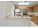 Bright kitchen featuring stainless steel appliances, and a view of the sink at 5302 E Van Buren St # 2060, Phoenix, AZ 85008