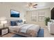 A well-lit main bedroom with neutral tones and a door leading to a balcony at 5302 E Van Buren St # 2060, Phoenix, AZ 85008