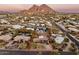 Wide aerial view showing the property with a mountain view in the background at 5507 N Calle Del Santo --, Phoenix, AZ 85018