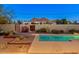 Backyard at night features a pool and gorgeous views of the mountains at 5507 N Calle Del Santo --, Phoenix, AZ 85018