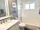 Bright bathroom featuring a shower-over-tub, white subway tile, modern fixtures, and a granite countertop at 5507 N Calle Del Santo --, Phoenix, AZ 85018