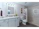 Bright bathroom featuring a marble shower, sleek vanity, and modern lighting fixtures at 5507 N Calle Del Santo --, Phoenix, AZ 85018