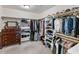 Organized walk-in closet with custom shelving and ample storage space for clothes and shoes at 5507 N Calle Del Santo --, Phoenix, AZ 85018