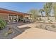 Expansive patio seamlessly blending indoor and outdoor living with desert landscaping and modern design at 5507 N Calle Del Santo --, Phoenix, AZ 85018