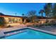 Stunning backyard with a refreshing pool, desert landscaping, and covered patio for outdoor entertaining at 5507 N Calle Del Santo --, Phoenix, AZ 85018