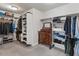 Spacious walk-in closet featuring custom shelving, clothing rods, and a dresser for optimal organization at 5507 N Calle Del Santo --, Phoenix, AZ 85018