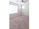 Spacious bedroom with bright natural light from a large window and neutral carpet at 559 E Rainbow Dr, Chandler, AZ 85249