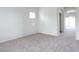 Bright bedroom with neutral carpeting and an arched doorway for a spacious feel at 559 E Rainbow Dr, Chandler, AZ 85249