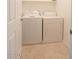 Laundry area featuring a side-by-side washer and dryer, as well as built-in shelving at 559 E Rainbow Dr, Chandler, AZ 85249