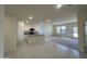 Bright and airy living room seamlessly connected to a modern kitchen with white cabinets at 5722 E Orion Rd, Florence, AZ 85132