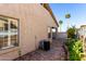 Exterior view of home and landscape with flagstone and palm trees at 5826 E Nathan St, Mesa, AZ 85215