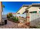 Charming backyard with painted mural, desert landscaping, and stone-paved patio at 5826 E Nathan St, Mesa, AZ 85215