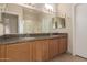 Double sink bathroom with large mirror, vanity, and tiled floor at 5826 E Nathan St, Mesa, AZ 85215