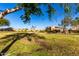 Scenic green space featuring mature trees, manicured landscaping, and well-maintained lawn at 5826 E Nathan St, Mesa, AZ 85215