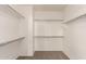 Spacious walk-in closet with ample shelving and clothing rods for optimal storage and organization at 5826 E Nathan St, Mesa, AZ 85215