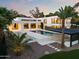 Expansive backyard featuring a pool, modern pergola, and meticulously designed landscape at 6216 N 38Th Pl, Paradise Valley, AZ 85253