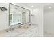 Elegant bathroom featuring double sinks, white marble countertops, and a large framed mirror at 6216 N 38Th Pl, Paradise Valley, AZ 85253