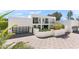 Modern white home with black framed windows, a black garage door, and desert landscaping at 6216 N 38Th Pl, Paradise Valley, AZ 85253