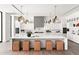 Bright, modern kitchen featuring a large island with seating and designer pendant lights at 6216 N 38Th Pl, Paradise Valley, AZ 85253