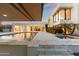 Luxurious pool area with marble patio and views of a modern home's architectural design at 6216 N 38Th Pl, Paradise Valley, AZ 85253