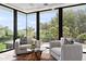 Bright sitting area boasts hardwood floors, comfortable chairs with throw pillows, and outdoor views at 6216 N 38Th Pl, Paradise Valley, AZ 85253